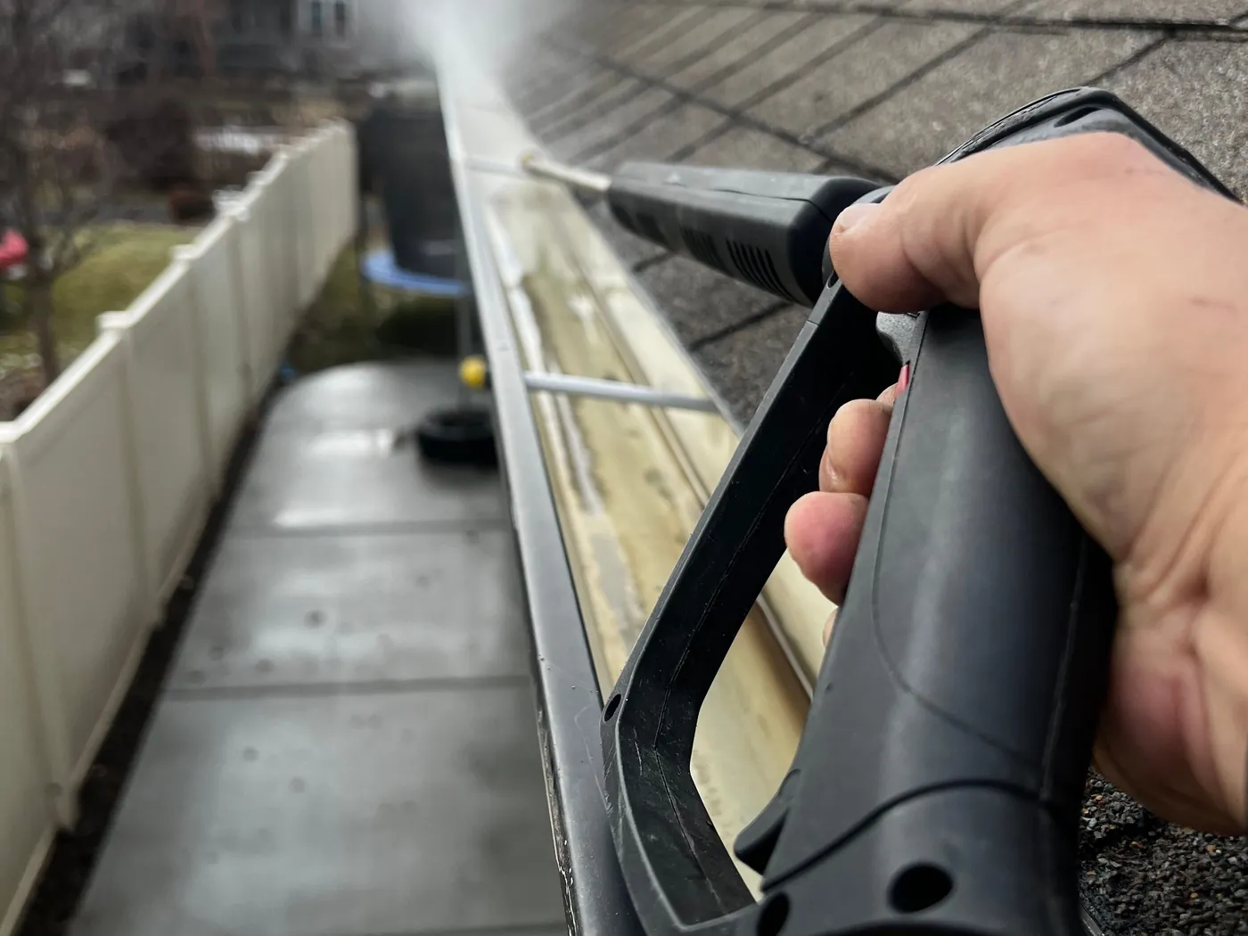Gutter clearance being carried out on a house roofline
