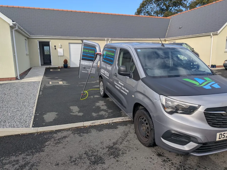 The Window Man van outside a bungalow with a conservatory